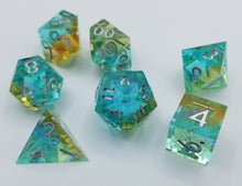 Load image into Gallery viewer, Light teal blue layer and gold top layer transparent dice with very small gold glitter throughout