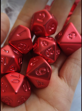 Load image into Gallery viewer, red electroplating creates a solid metal looking resin dice set. Non-inked numbers with Talys Dragon. 7 Piece Standard Size Dice Set