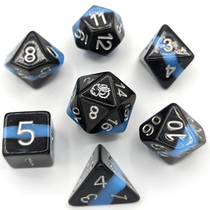 Solid black layer, electric light blue, and black layer. Silver font with Talys Dragon. 7 Piece Standard Size Dice Set