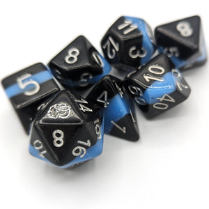 Solid black layer, electric light blue, and black layer. Silver font with Talys Dragon. 7 Piece Standard Size Dice Set