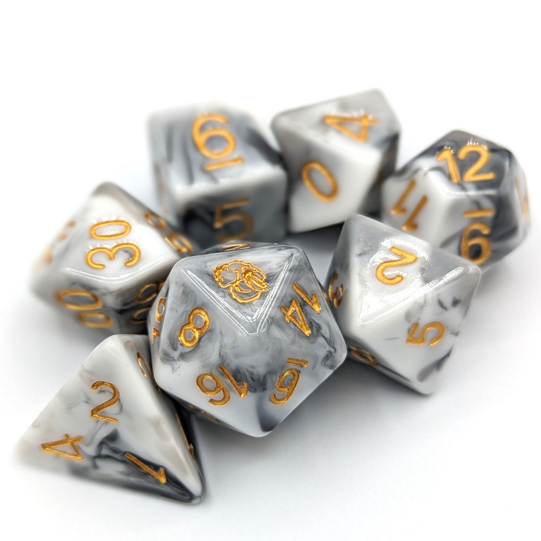 Solid white dice with grey lines going throughout like the stone. Gold font with Talys Dragon. 7 Piece Standard Size Dice Set