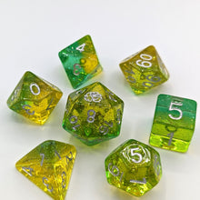 Load image into Gallery viewer, Transparent light green lime layer and light yellow transparent lemon layer with silver glitter throughout. Silver font with Talys Dragon. 7 Piece Standard Size Dice Set