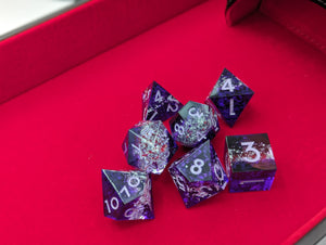 3 Layer dice with dark transparent purple layer, then clear layer with dense small silver glitter, and another dark purple transparent purple layer. Light purple ink