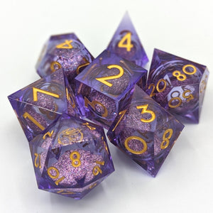purple set with dark pink sand liquid core with a special D4 and gold font. 
