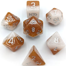 Load image into Gallery viewer, White solid shimmer layer and caramel solid shimmer layer. Silver font with Talys Dragon. 7 Piece Standard Size Dice Set