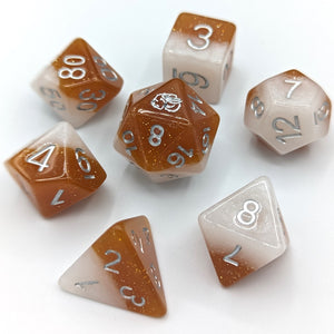White solid shimmer layer and caramel solid shimmer layer. Silver font with Talys Dragon. 7 Piece Standard Size Dice Set