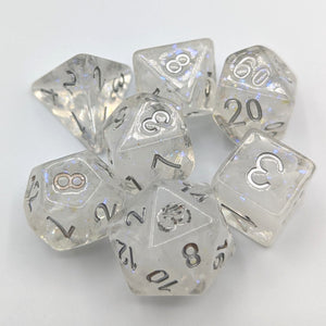 Clear dice with nebula white swirls and glitter inside creating a snow globe effect. Silver font with Talys Dragon. 7 Piece Standard Size Dice Set