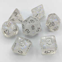 Load image into Gallery viewer, Clear dice with nebula white swirls and glitter inside creating a snow globe effect. Silver font with Talys Dragon. 7 Piece Standard Size Dice Set
