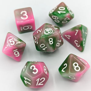 Light green, pink, and white marbled dice. White font with Talys Dragon. 7 Piece Standard Size Dice Set