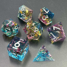 Load image into Gallery viewer, Transparent light blue, then light yellow, then light pink layers. Medium sized gold, pink, and blue flakes throughout the dice