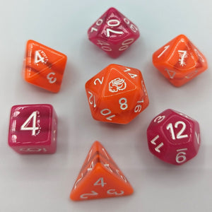 Bright orange opaque D20, D10, D8, and D4 with 2 clear stripes. Darker but vibrant pink opaque D12, D00, and D6 with 2 clear stripes. White font with Talys Dragon. 7 Piece Standard Size Dice Set