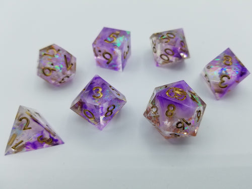 Purple nebula pattern transparent dice with multi-chromatic foil. Gold ink