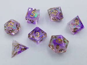 Purple nebula pattern transparent dice with multi-chromatic foil. Gold ink