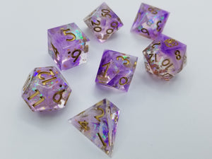 Purple nebula pattern transparent dice with multi-chromatic foil. Gold ink
